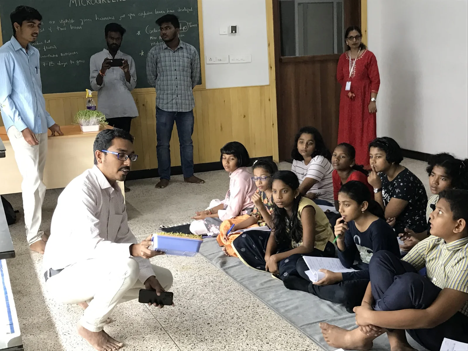 Children learning about microgreens at the first Kanha school pilot